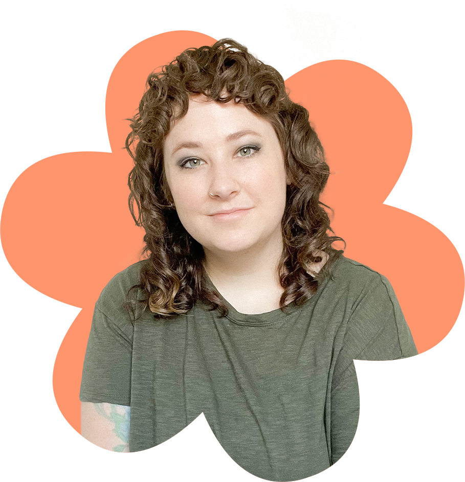 a photo of a woman with brown hair wearing a green tshirt